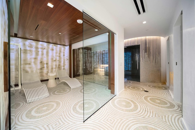 bathroom with tile patterned floors, visible vents, and wooden ceiling