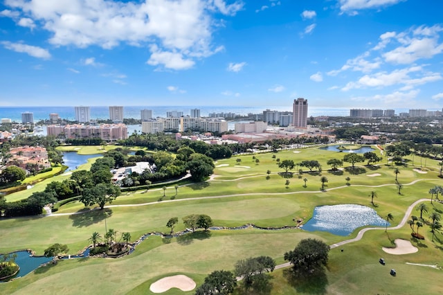 birds eye view of property with a city view, golf course view, and a water view