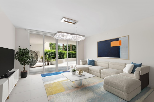 living area with tile patterned flooring, floor to ceiling windows, and an inviting chandelier