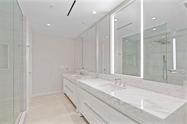 full bathroom with double vanity, recessed lighting, a shower with door, and a sink