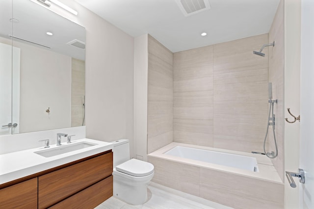 full bath featuring visible vents, toilet, tiled shower / bath, and vanity