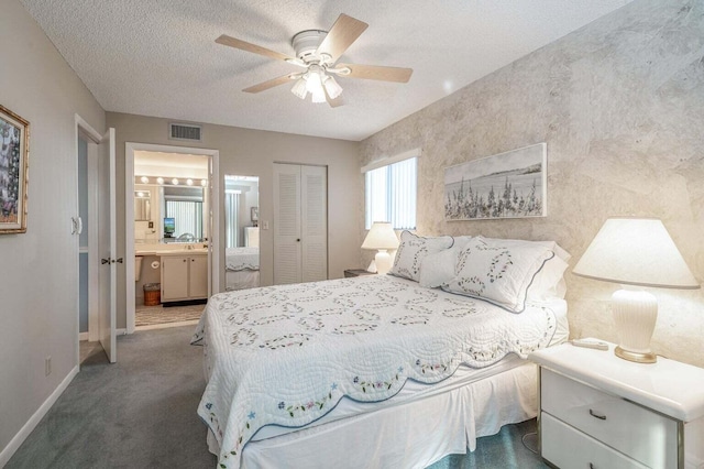 bedroom with visible vents, baseboards, carpet floors, a closet, and a textured ceiling