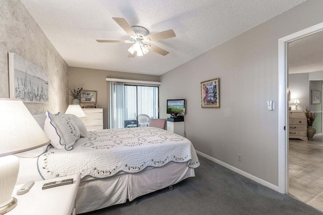 bedroom featuring carpet flooring, a textured ceiling, and baseboards