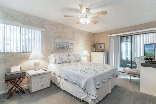 carpeted bedroom featuring a textured ceiling, a ceiling fan, and access to outside