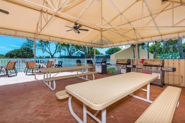 15469 Lakes Of Delray Blvd Unit 103, Delray Beach, FL 33484 - fenced backyard with area for grilling, outdoor dining space, a patio, and a ceiling fan