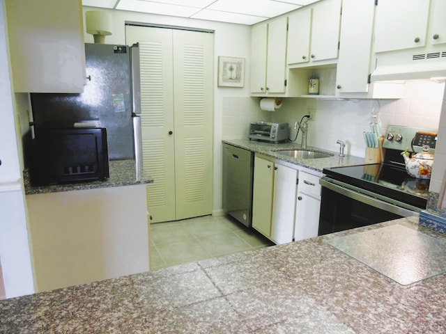 15469 Lakes Of Delray Blvd Unit 103, Delray Beach, FL 33484 - kitchen featuring custom exhaust hood, appliances with stainless steel finishes, light tile patterned floors, backsplash, and open shelves