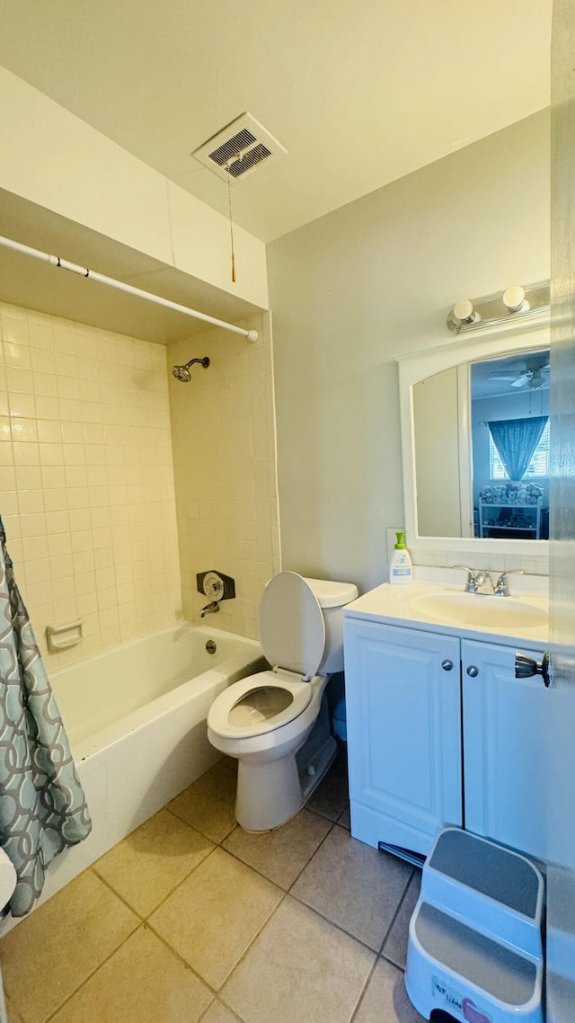 bathroom with tile patterned floors, visible vents, shower / bath combo with shower curtain, toilet, and vanity