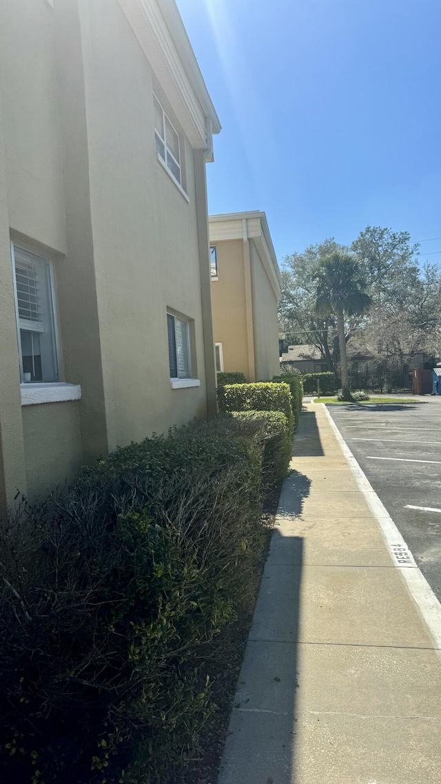 view of side of property featuring stucco siding