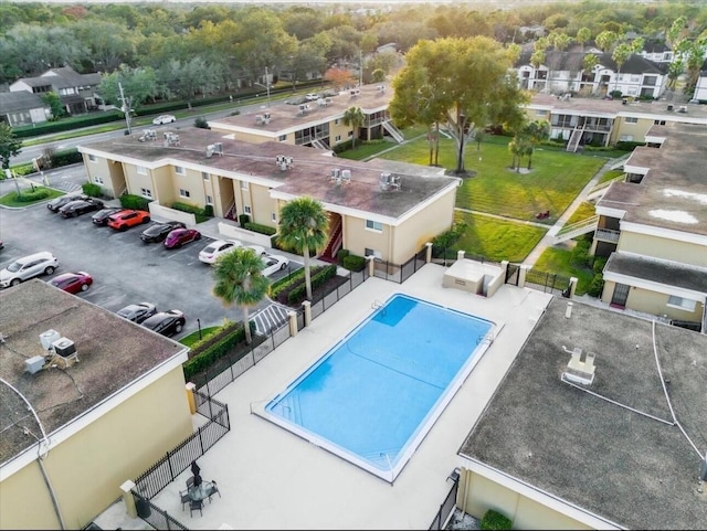 pool featuring a residential view and fence