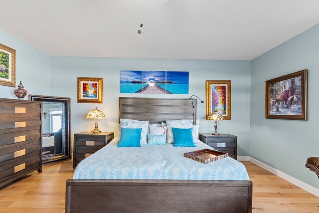 309 E Ocean Ave Unit 103, Lantana, FL 33462 - bedroom with baseboards and wood finished floors