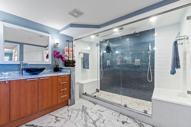 309 E Ocean Ave Unit 103, Lantana, FL 33462 - full bath featuring marble finish floor, vanity, and a stall shower