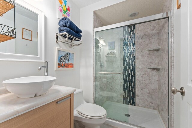 309 E Ocean Ave Unit 103, Lantana, FL 33462 - full bathroom with toilet, a stall shower, and vanity