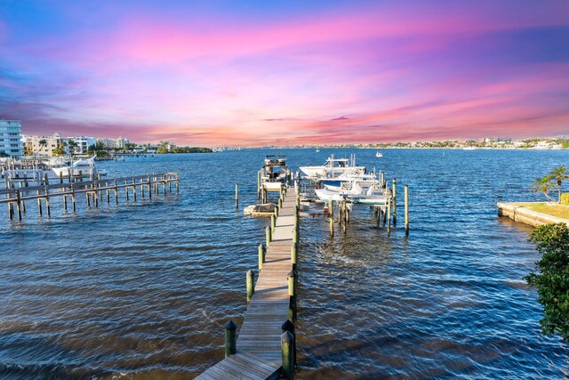 309 E Ocean Ave Unit 103, Lantana, FL 33462 - view of dock with boat lift and a water view