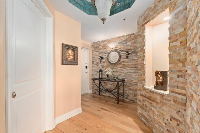 309 E Ocean Ave Unit 103, Lantana, FL 33462 - hall featuring baseboards and wood finished floors