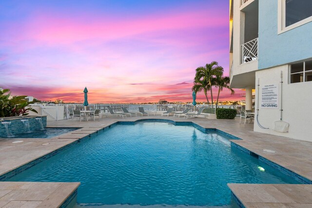 309 E Ocean Ave Unit 103, Lantana, FL 33462 - pool featuring a fenced backyard and a patio area