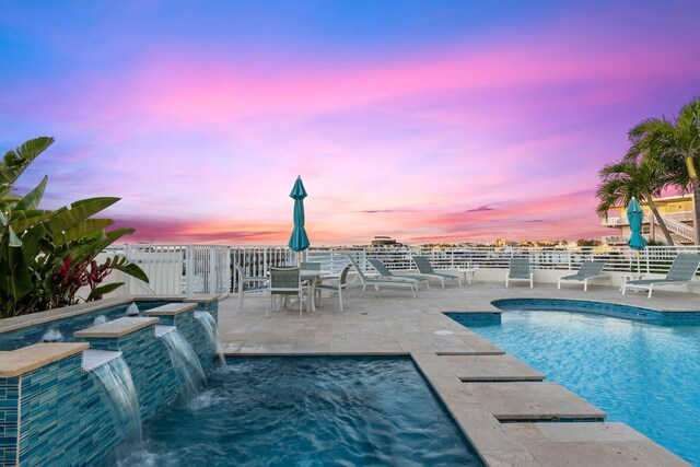 309 E Ocean Ave Unit 103, Lantana, FL 33462 - view of swimming pool featuring fence, a fenced in pool, a patio area, and a hot tub