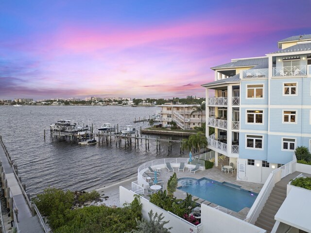 309 E Ocean Ave Unit 103, Lantana, FL 33462 - community pool with a water view, a boat dock, and a patio