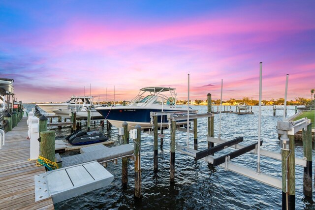 309 E Ocean Ave Unit 103, Lantana, FL 33462 - dock area featuring a water view and boat lift