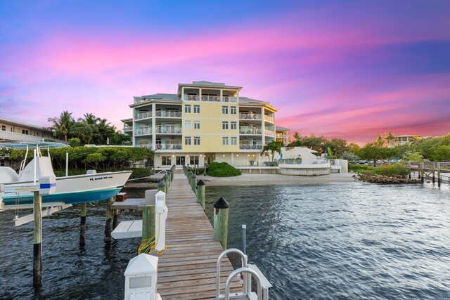 309 E Ocean Ave Unit 103, Lantana, FL 33462 - dock area featuring a water view and boat lift