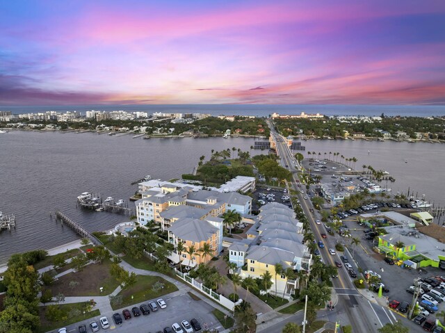 309 E Ocean Ave Unit 103, Lantana, FL 33462 - aerial view at dusk with a water view
