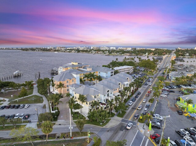 309 E Ocean Ave Unit 103, Lantana, FL 33462 - aerial view at dusk featuring a water view