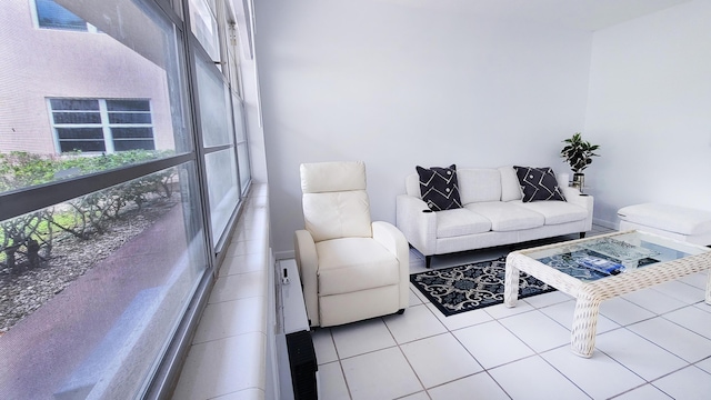 living area with light tile patterned floors and a wealth of natural light