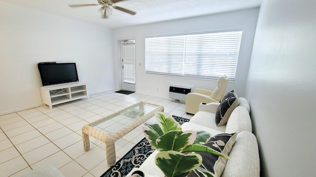 tiled living area with ceiling fan
