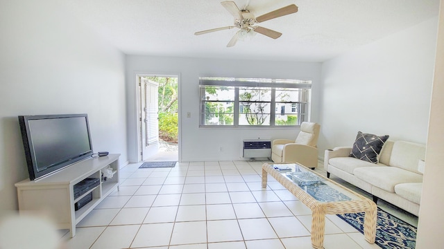 living room with heating unit and ceiling fan