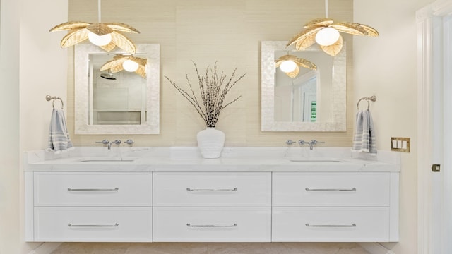 full bath with double vanity and a sink