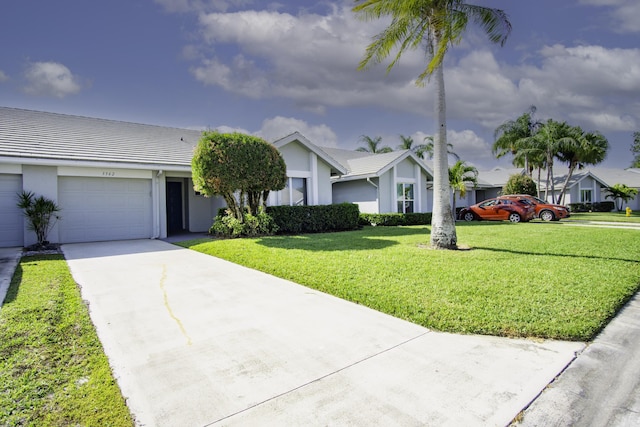 view of front facade featuring stucco siding, an attached garage, concrete driveway, and a front lawn