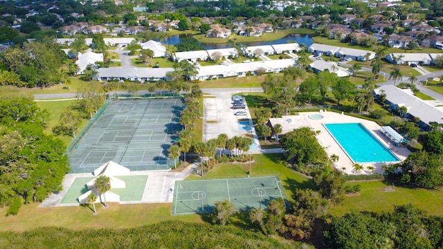 bird's eye view with a residential view and a water view