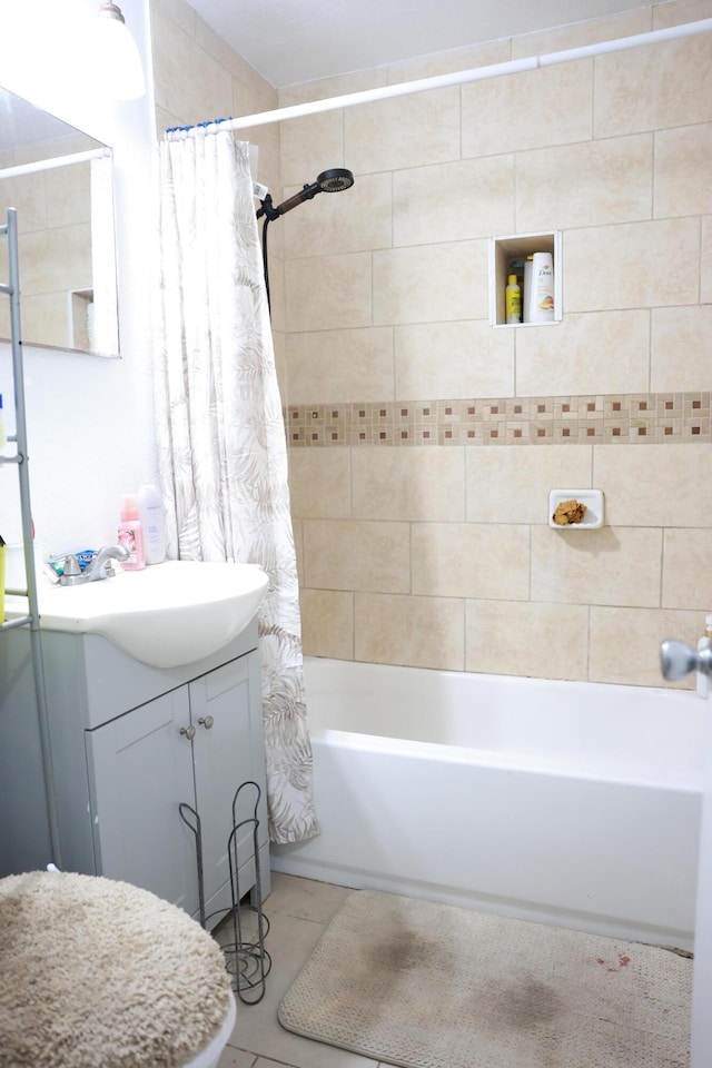 bathroom with vanity and shower / bath combination with curtain