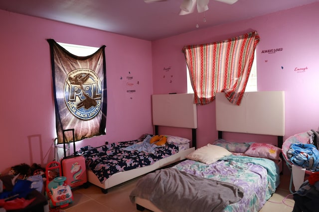 bedroom with tile patterned flooring and a ceiling fan