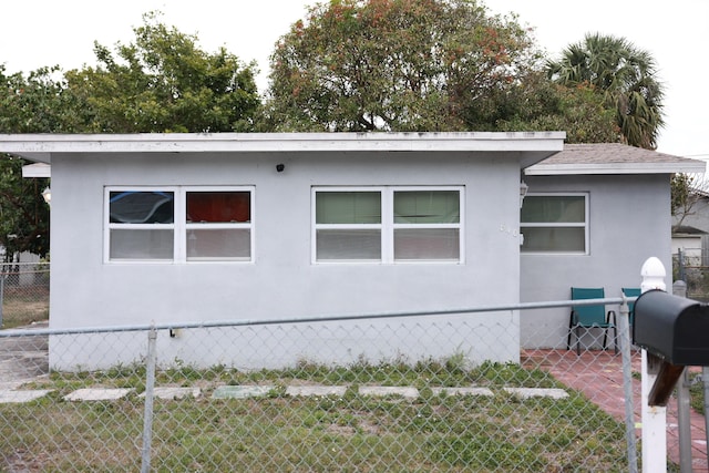 view of side of home with fence