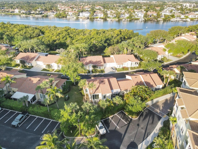 birds eye view of property with a residential view and a water view