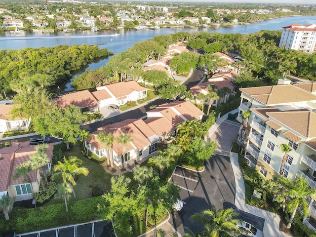 birds eye view of property with a residential view and a water view