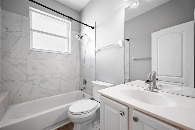 full bath featuring toilet, vanity, and shower / tub combination