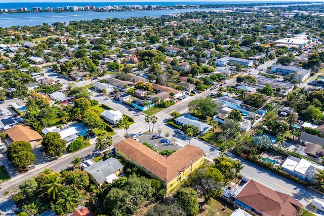 birds eye view of property featuring a water view and a residential view