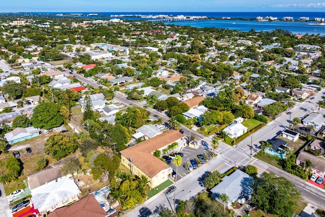 birds eye view of property featuring a water view and a residential view