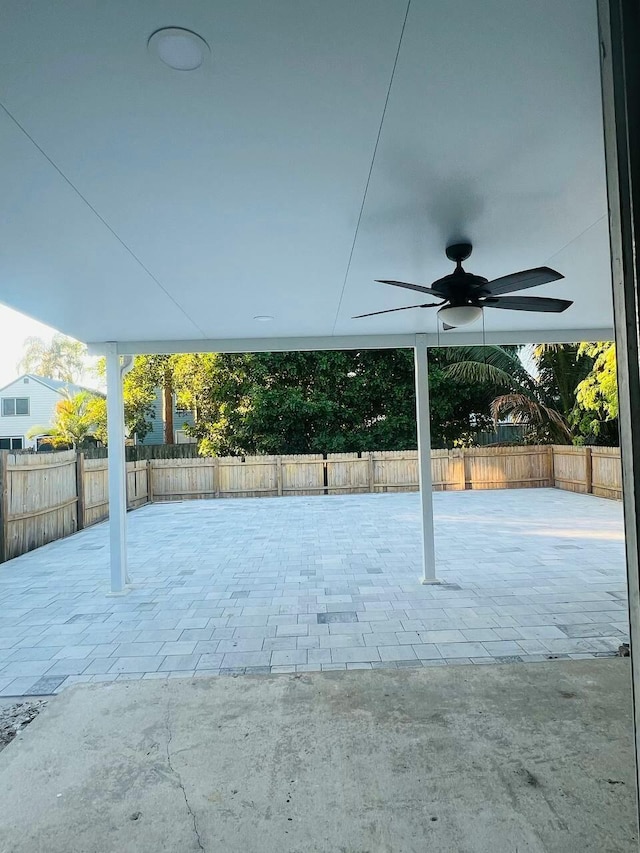 exterior space with a fenced backyard and a ceiling fan