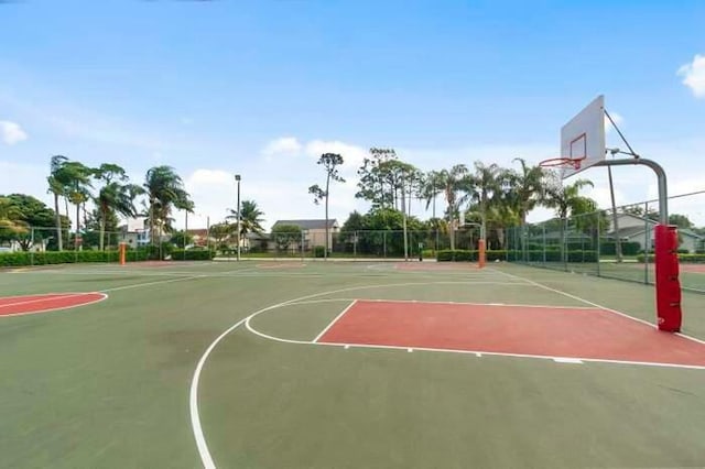 view of sport court with community basketball court and fence