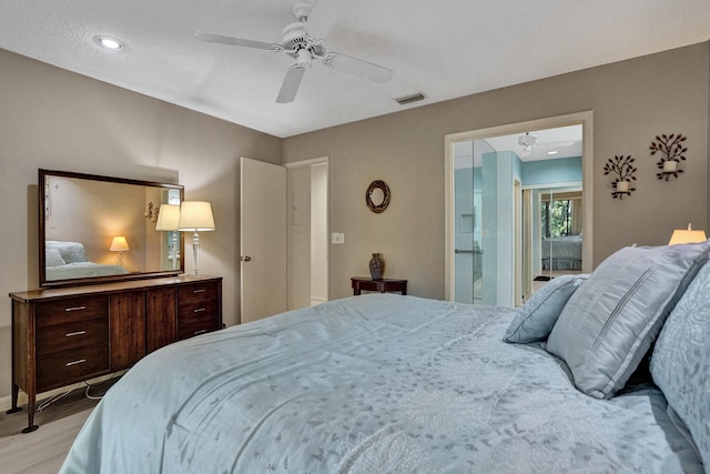 bedroom featuring a ceiling fan, visible vents, and light wood-type flooring