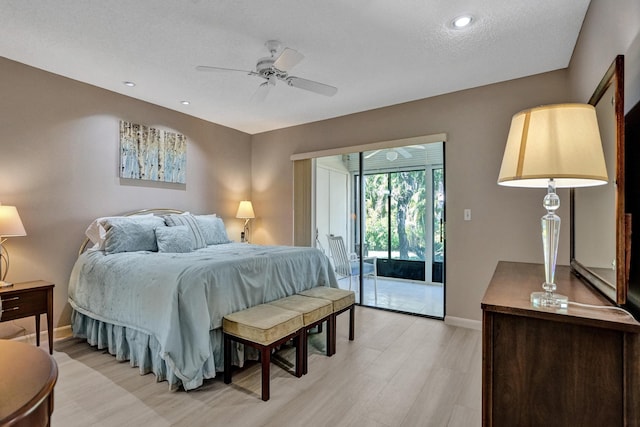 bedroom with access to exterior, baseboards, light wood finished floors, and ceiling fan