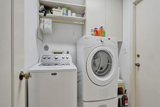 washroom featuring laundry area and independent washer and dryer