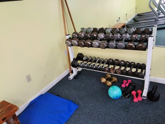 exercise room with baseboards