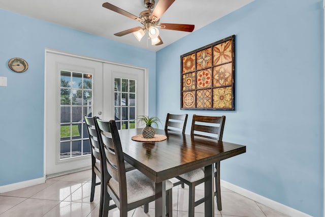 dining space with light tile patterned flooring, french doors, baseboards, and ceiling fan