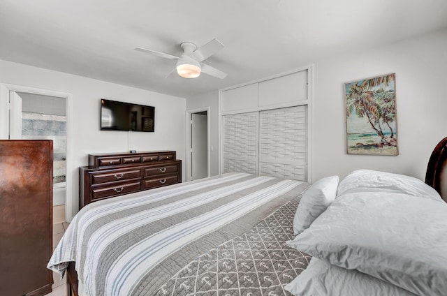 bedroom featuring a ceiling fan, a closet, and connected bathroom