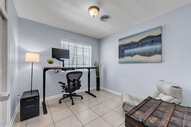 office with light tile patterned flooring, visible vents, and baseboards