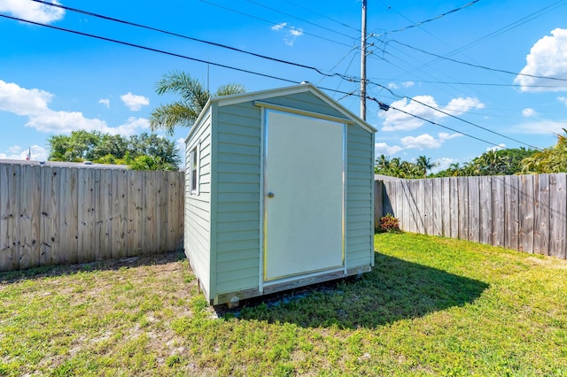 view of shed featuring a fenced backyard