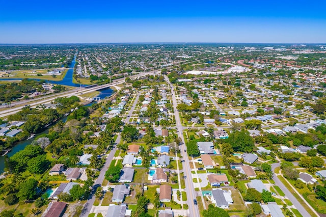 birds eye view of property featuring a residential view and a water view